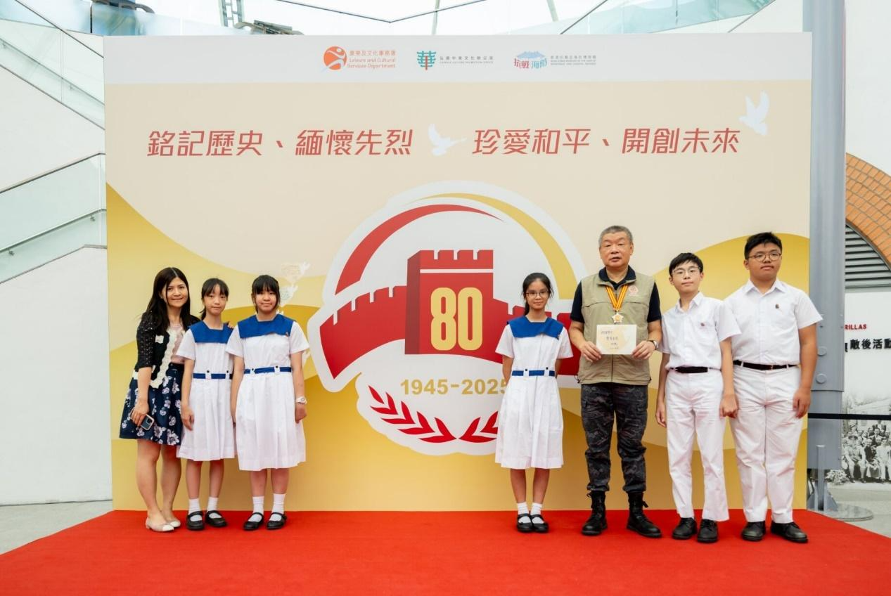 A group of people posing for a photoDescription automatically generated