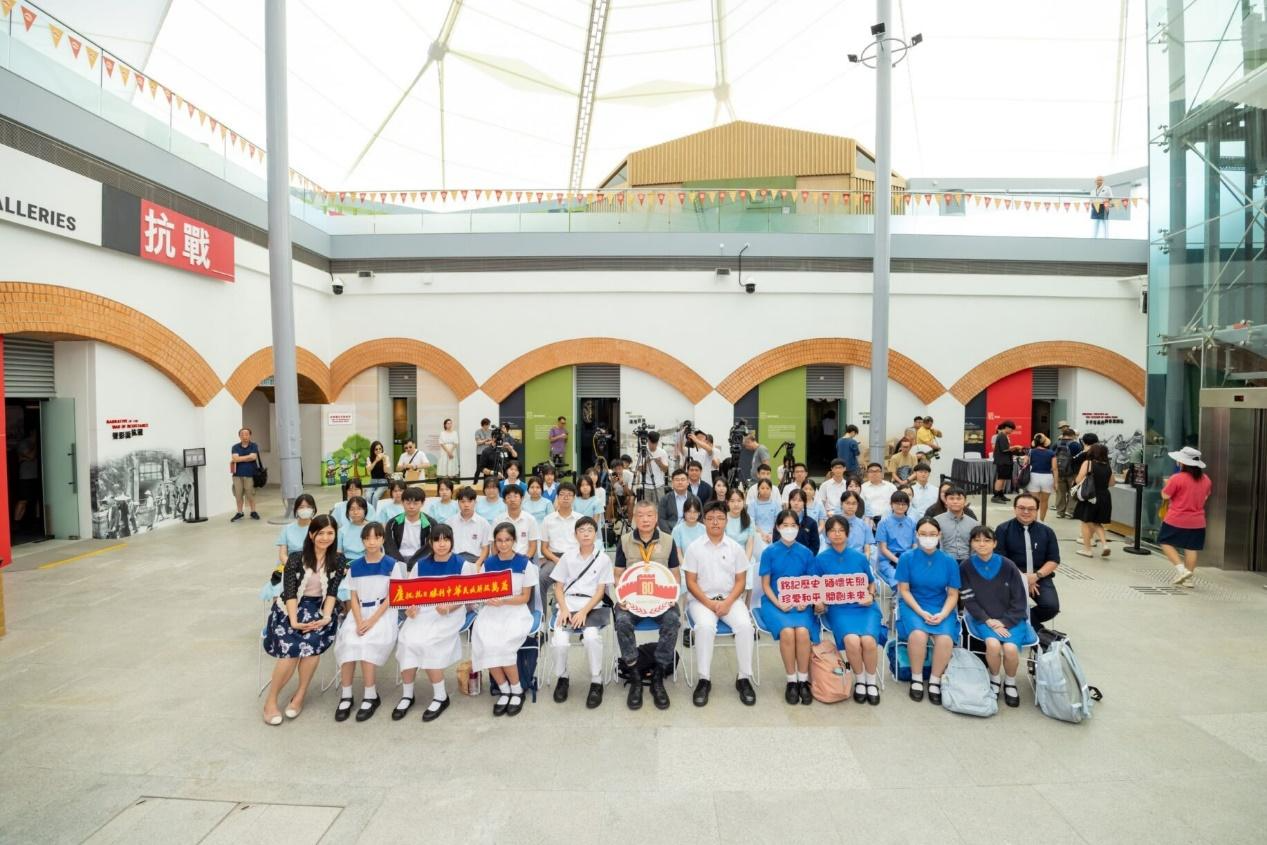 A group of people posing for a photoDescription automatically generated